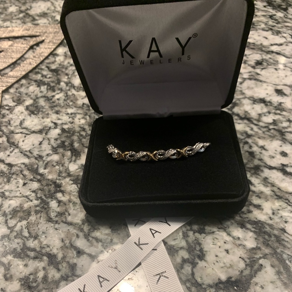 Infinity Bracelet 1/20 ct tw Diamonds Sterling Silver and Gold
